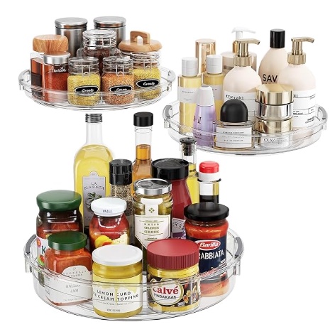 Clear rotating LAMU Lazy Susan organizers holding pantry and household products.